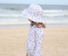 Load image into Gallery viewer, Sun hat and girls swimsuit in Floral Whisper at the beach